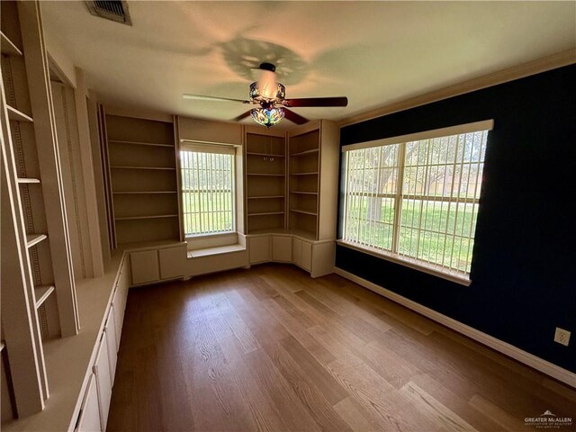 6501 Magnum Rd, Mission, TX 78573 - unfurnished room with ceiling fan and wood finished floors
