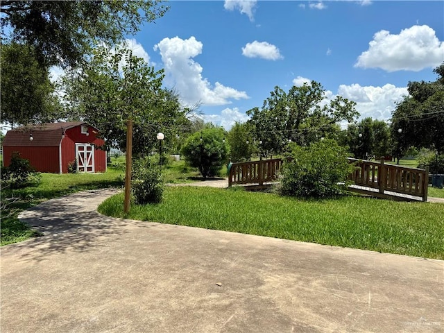 6501 Magnum Rd, Mission, TX 78573 - view of grassy yard with a shed