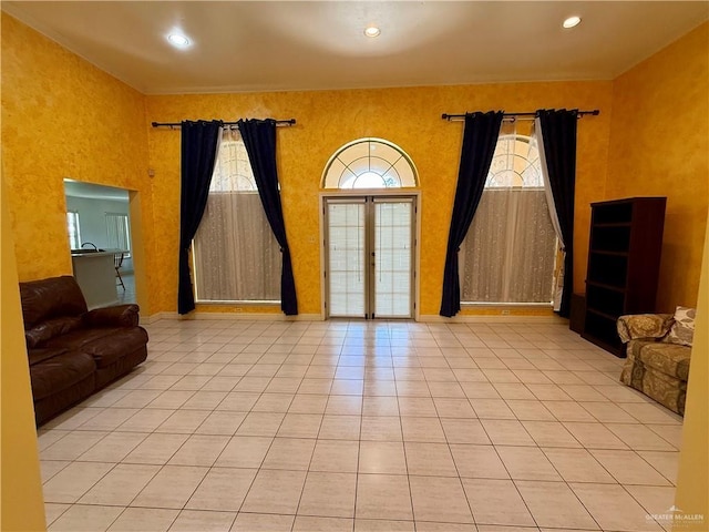 6501 Magnum Rd, Mission, TX 78573 - unfurnished living room with tile patterned flooring, recessed lighting, and french doors