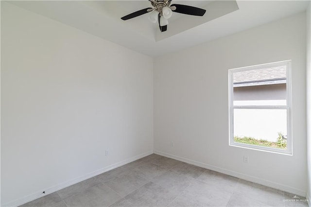 spare room featuring a wealth of natural light and ceiling fan