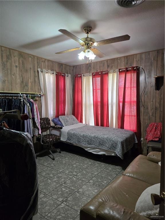 1215 Oak St, Mission, TX 78572 - bedroom with wood walls and ceiling fan