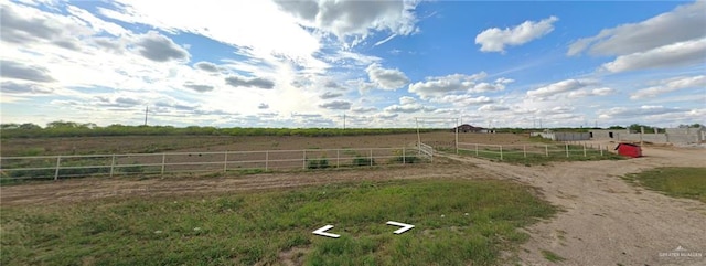 view of yard with a rural view