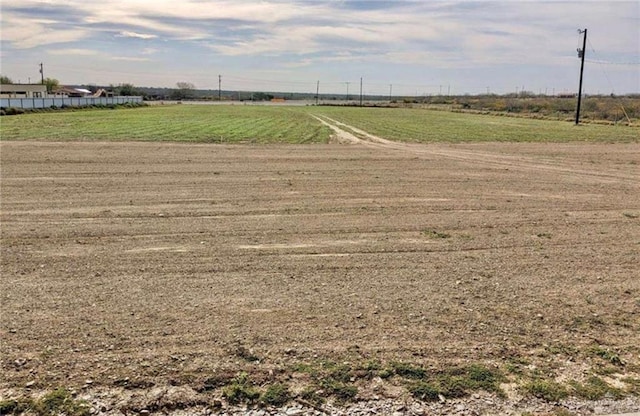 view of yard with a rural view