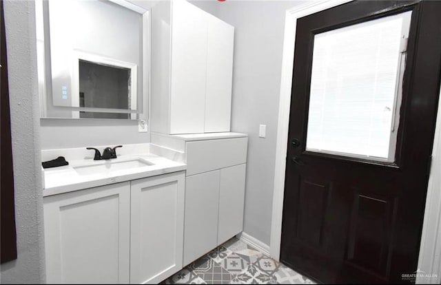 bathroom with vanity and a healthy amount of sunlight