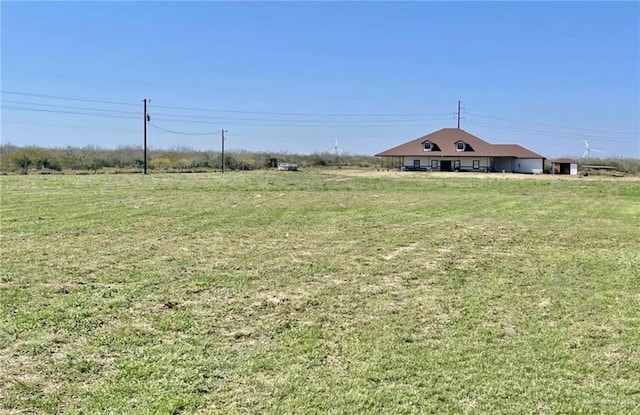 view of yard with a rural view