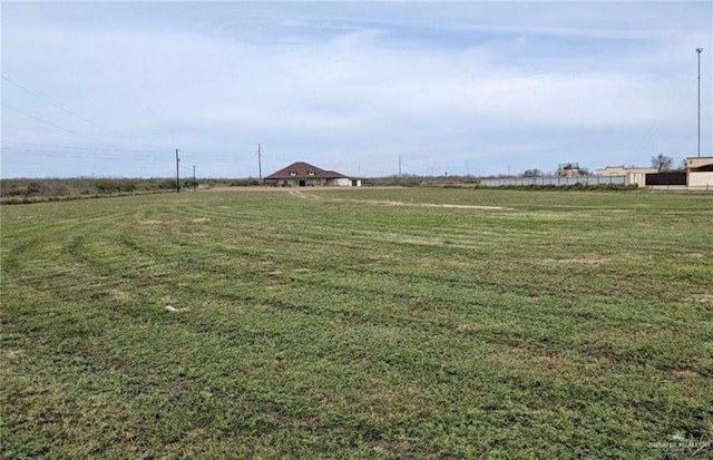 view of yard with a rural view