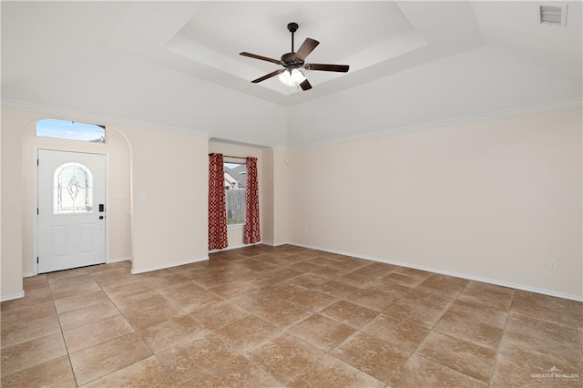 2002 Butkus Dr, Edinburg, TX 78542 - entrance foyer with a tray ceiling, a ceiling fan, arched walkways, and baseboards
