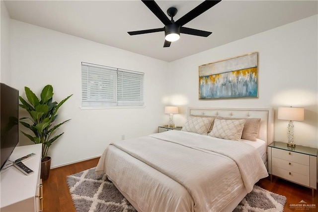 bedroom with dark wood-type flooring and ceiling fan