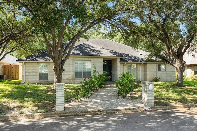 ranch-style home with central AC unit