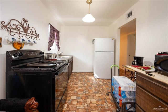 kitchen with sink and black appliances