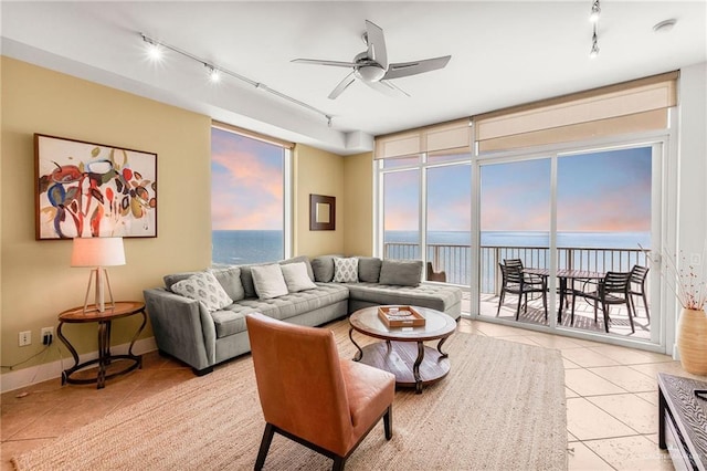 310A Padre Blvd Unit 2304, South Padre Island, TX 78597 - living room with rail lighting, light tile patterned floors, and a ceiling fan
