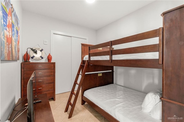 310A Padre Blvd Unit 2304, South Padre Island, TX 78597 - bedroom with light tile patterned floors and a closet