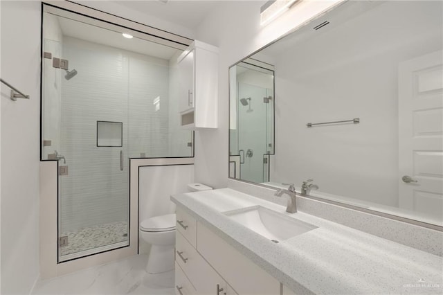 2810 E Uva Ave, Hidalgo, TX 78557 - full bathroom featuring toilet, a stall shower, vanity, and marble finish floors