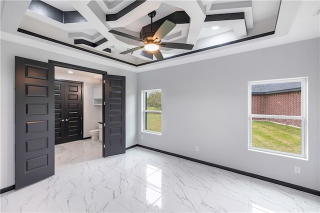 interior space featuring ceiling fan and coffered ceiling