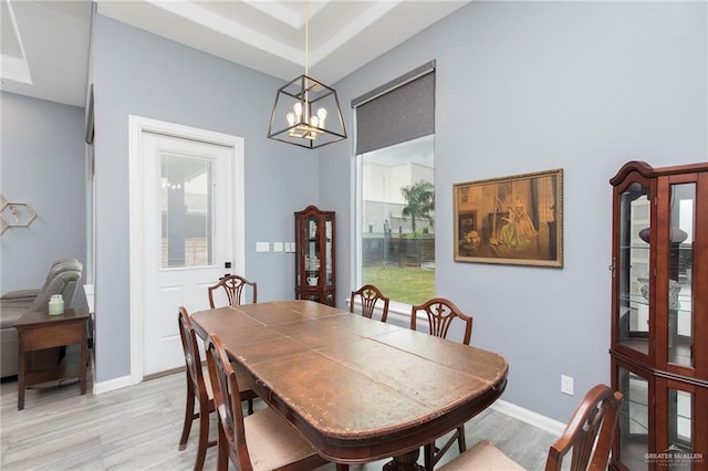 1803 Lago Michigan St, Edinburg, TX 78542 - dining room with light wood-style floors and a chandelier
