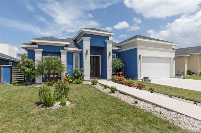 1803 Lago Michigan St, Edinburg, TX 78542 - prairie-style home featuring a garage, a front yard, driveway, and stucco siding