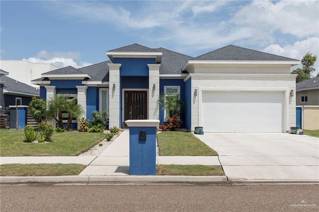 1803 Lago Michigan St, Edinburg, TX 78542 - prairie-style home with an attached garage, a front yard, driveway, stucco siding, and a shingled roof
