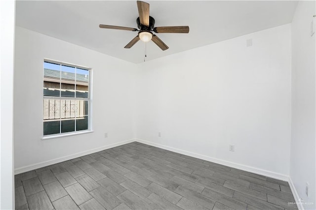 empty room with ceiling fan and hardwood / wood-style flooring