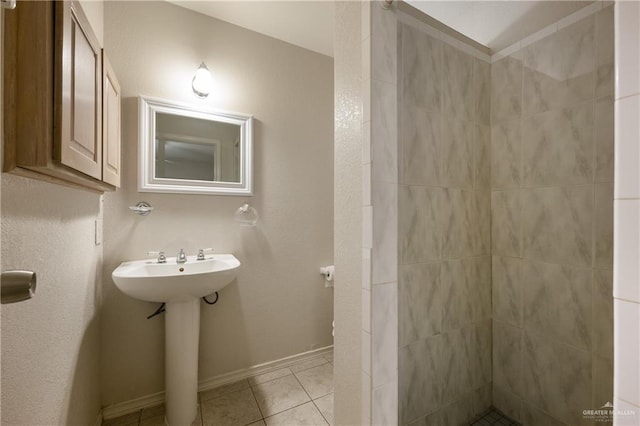 bathroom with tile patterned flooring and sink