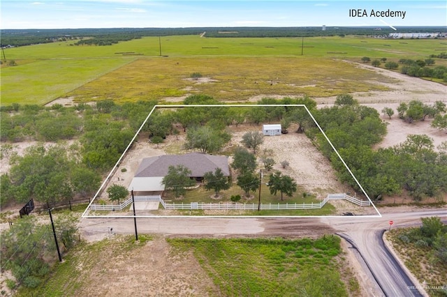 birds eye view of property featuring a rural view