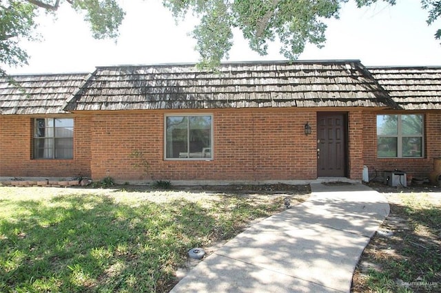 333 Forest Hills Dr Unit 2, Weslaco, TX 78596 - exterior space with a front lawn and brick siding