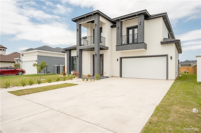 1711 Lago Delton, Edinburg, TX 78542 - contemporary home with a balcony, driveway, a garage, and a front lawn