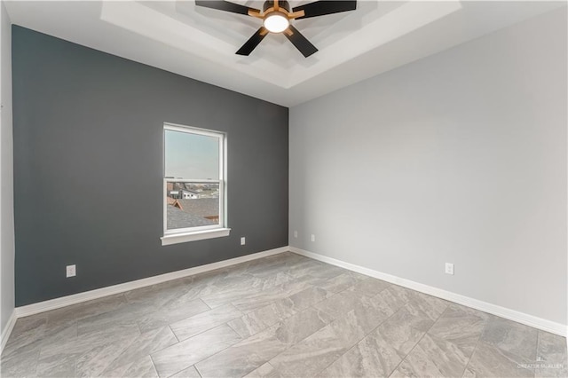 1711 Lago Delton, Edinburg, TX 78542 - spare room featuring a raised ceiling, a ceiling fan, and baseboards