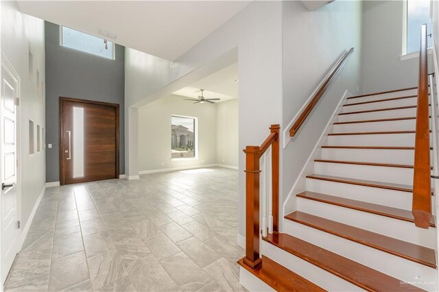 1711 Lago Delton, Edinburg, TX 78542 - entryway featuring stairs, healthy amount of natural light, a high ceiling, ceiling fan, and baseboards