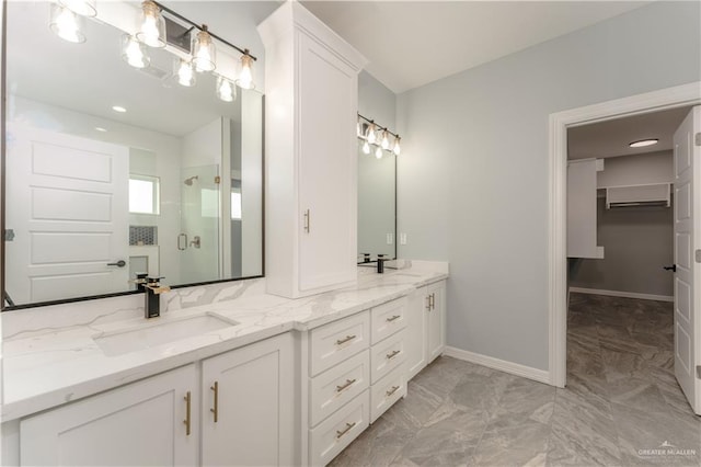 1711 Lago Delton, Edinburg, TX 78542 - bathroom with a shower stall, double vanity, marble finish floors, baseboards, and an AC wall unit