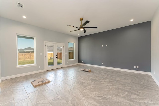 1711 Lago Delton, Edinburg, TX 78542 - empty room featuring plenty of natural light, french doors, ceiling fan, baseboards, and recessed lighting