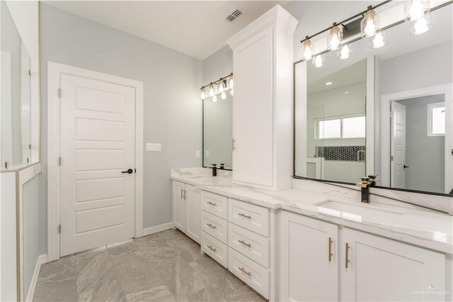 1711 Lago Delton, Edinburg, TX 78542 - full bath with marble finish floors, double vanity, and baseboards