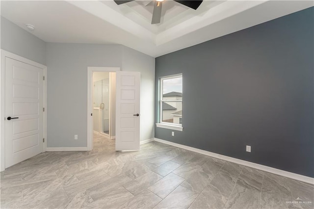 1711 Lago Delton, Edinburg, TX 78542 - unfurnished bedroom featuring a raised ceiling, baseboards, a ceiling fan, and marble look tiles