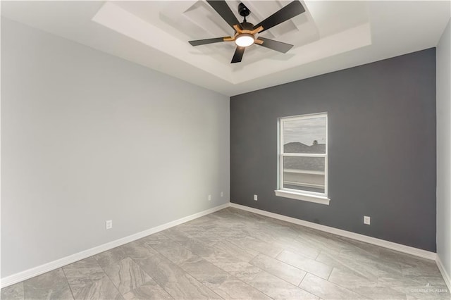 1711 Lago Delton, Edinburg, TX 78542 - unfurnished room featuring a raised ceiling, a ceiling fan, and baseboards