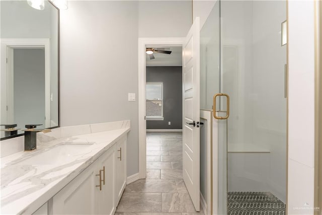 1711 Lago Delton, Edinburg, TX 78542 - bathroom with a shower stall, baseboards, a ceiling fan, and vanity