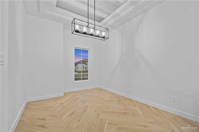 unfurnished dining area featuring light parquet floors and a notable chandelier