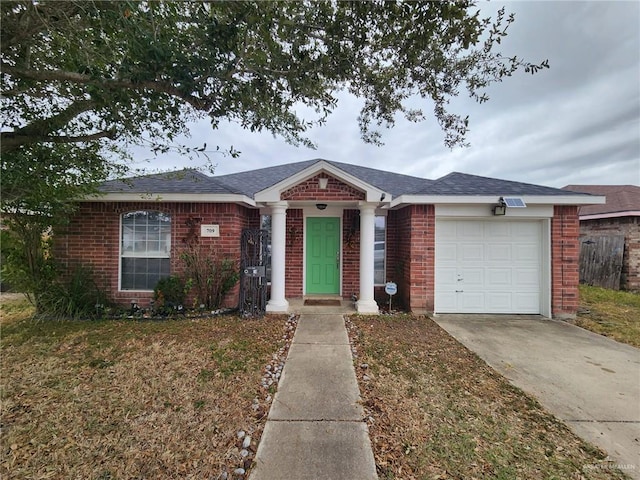 ranch-style house featuring a garage and a front yard