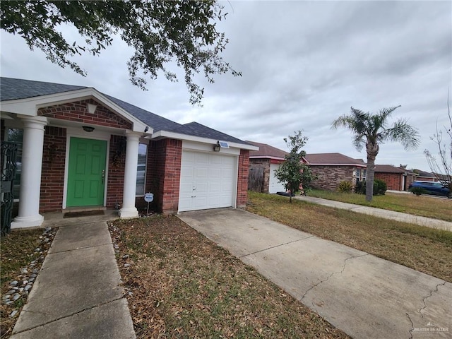 single story home with a garage and a front yard