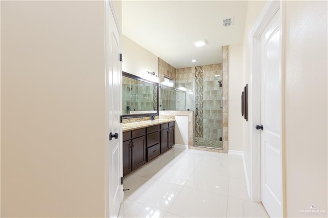 full bath featuring a stall shower, tile patterned flooring, visible vents, and vanity