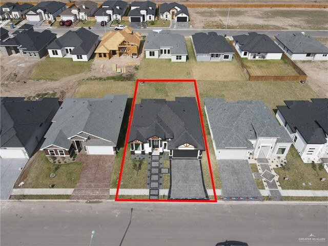 birds eye view of property with a residential view