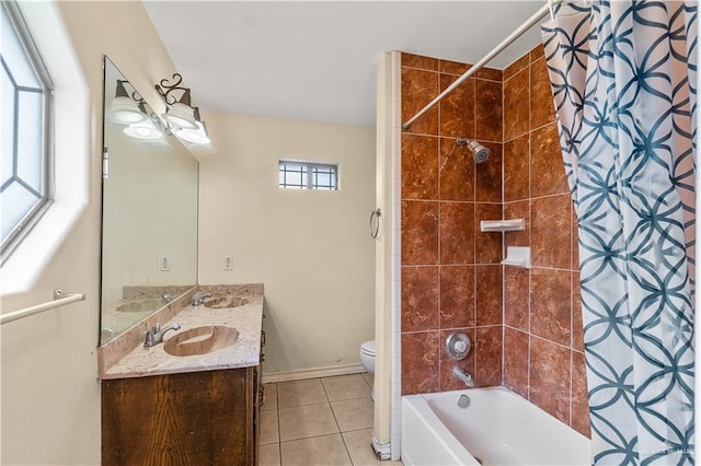 full bathroom with toilet, vanity, tile patterned floors, and tiled shower / bath combo