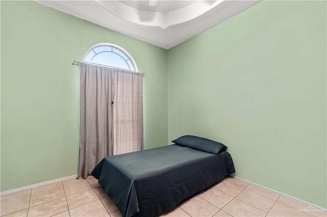 bedroom featuring ceiling fan and light tile patterned flooring