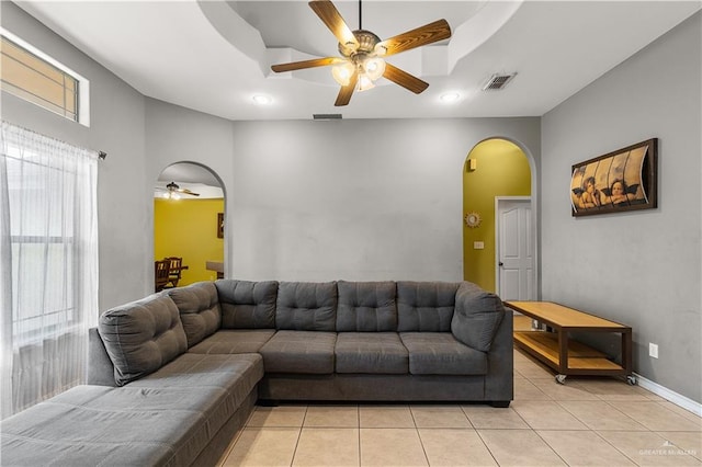 living room with ceiling fan and light tile patterned floors