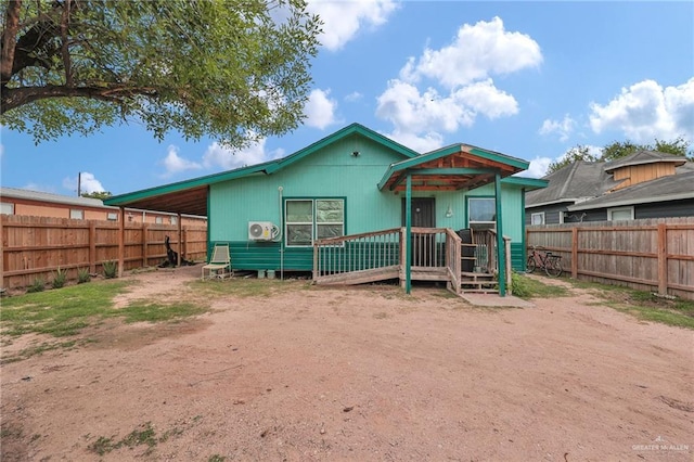 2304 Jose De La Cruz Rd, Mission, TX 78574 - rear view of house featuring a wooden deck and a fenced backyard