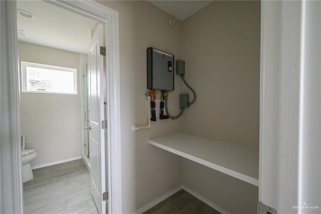 interior space featuring light hardwood / wood-style floors and water heater