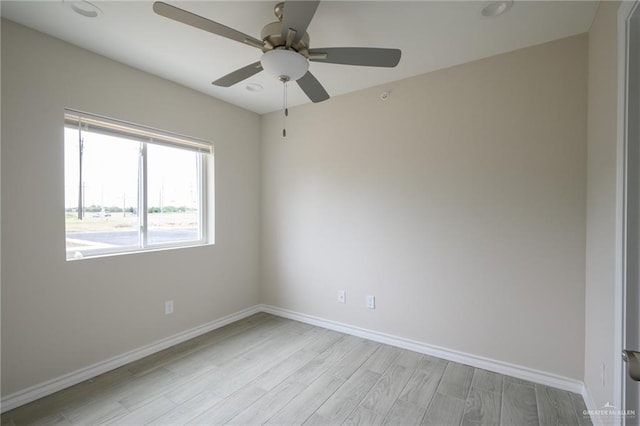 unfurnished room featuring ceiling fan and light hardwood / wood-style floors