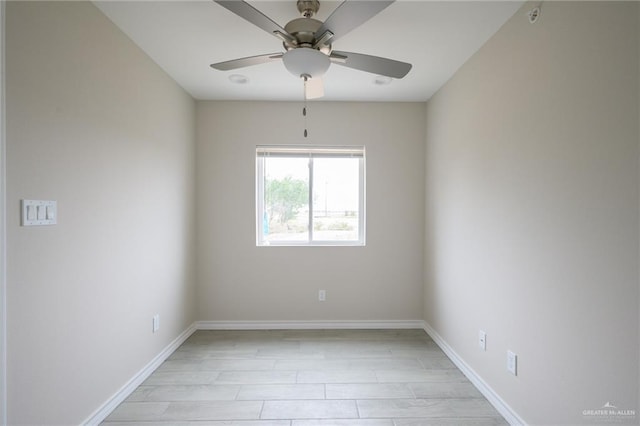 spare room with ceiling fan and light wood-type flooring