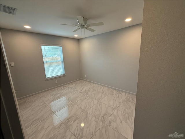 spare room featuring baseboards, visible vents, ceiling fan, marble finish floor, and recessed lighting