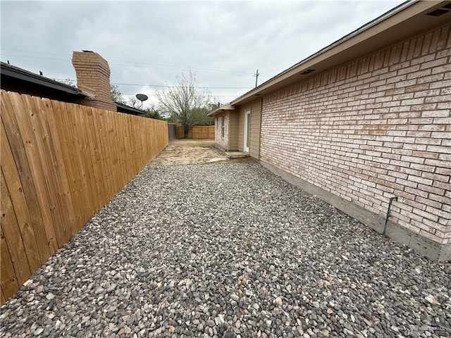 view of yard featuring a patio area and fence