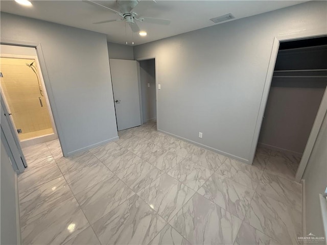 unfurnished bedroom featuring baseboards, visible vents, ensuite bathroom, marble finish floor, and a spacious closet