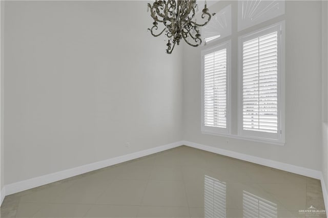 2502 Sandstone Dr, Mission, TX 78574 - tiled empty room with a chandelier and baseboards